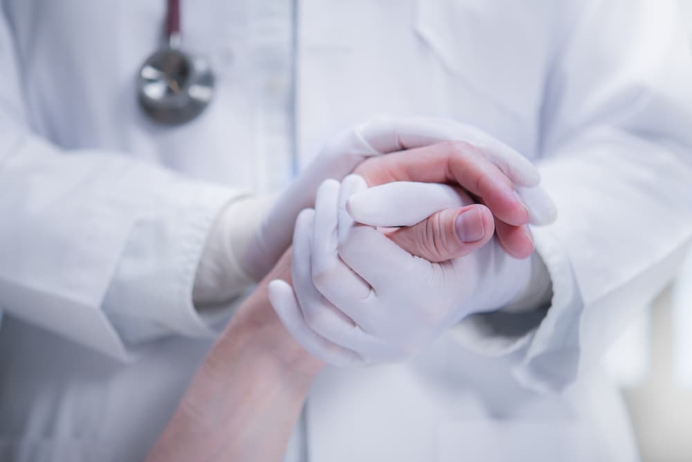 doctor comforting his patient